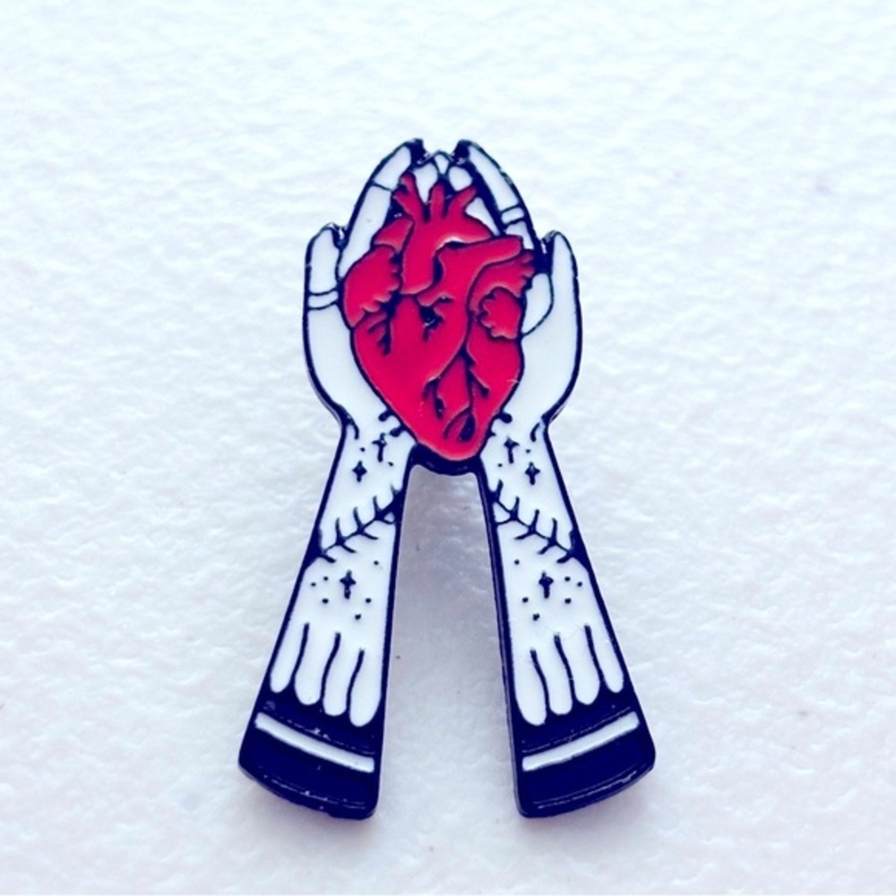 Hands holding a Heart Enamel Unisex Enamel Pin, NWT